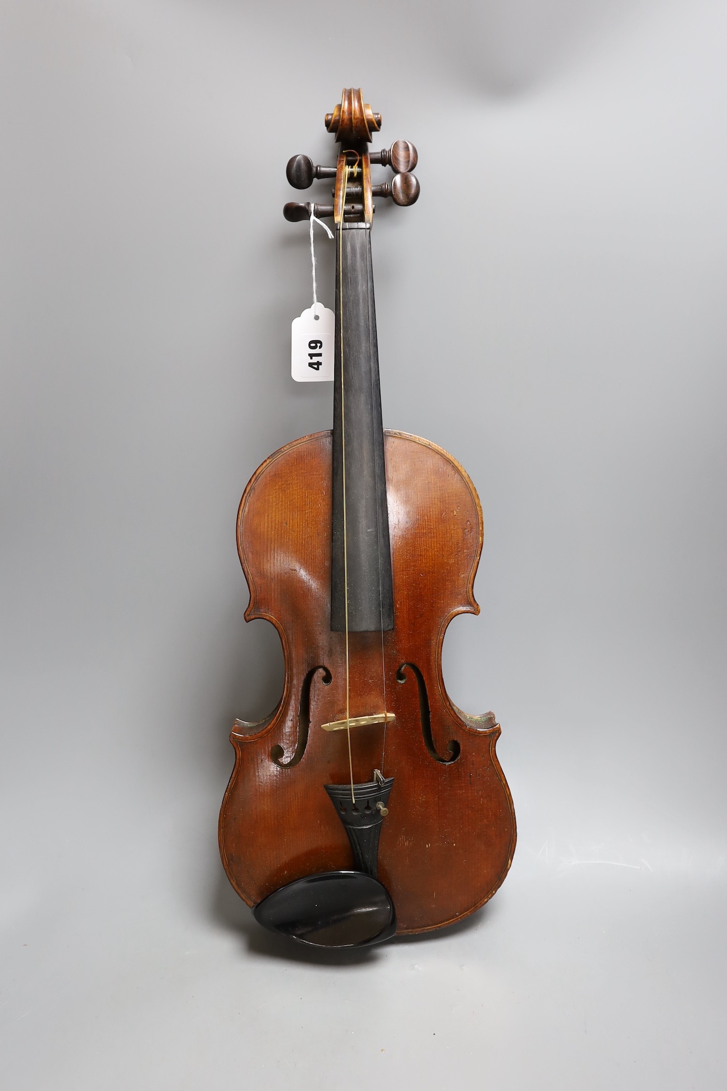 A cased late 19th century English violin, inscribed W. Heaton maker 1887 (?), back measures 35.5cm excl button